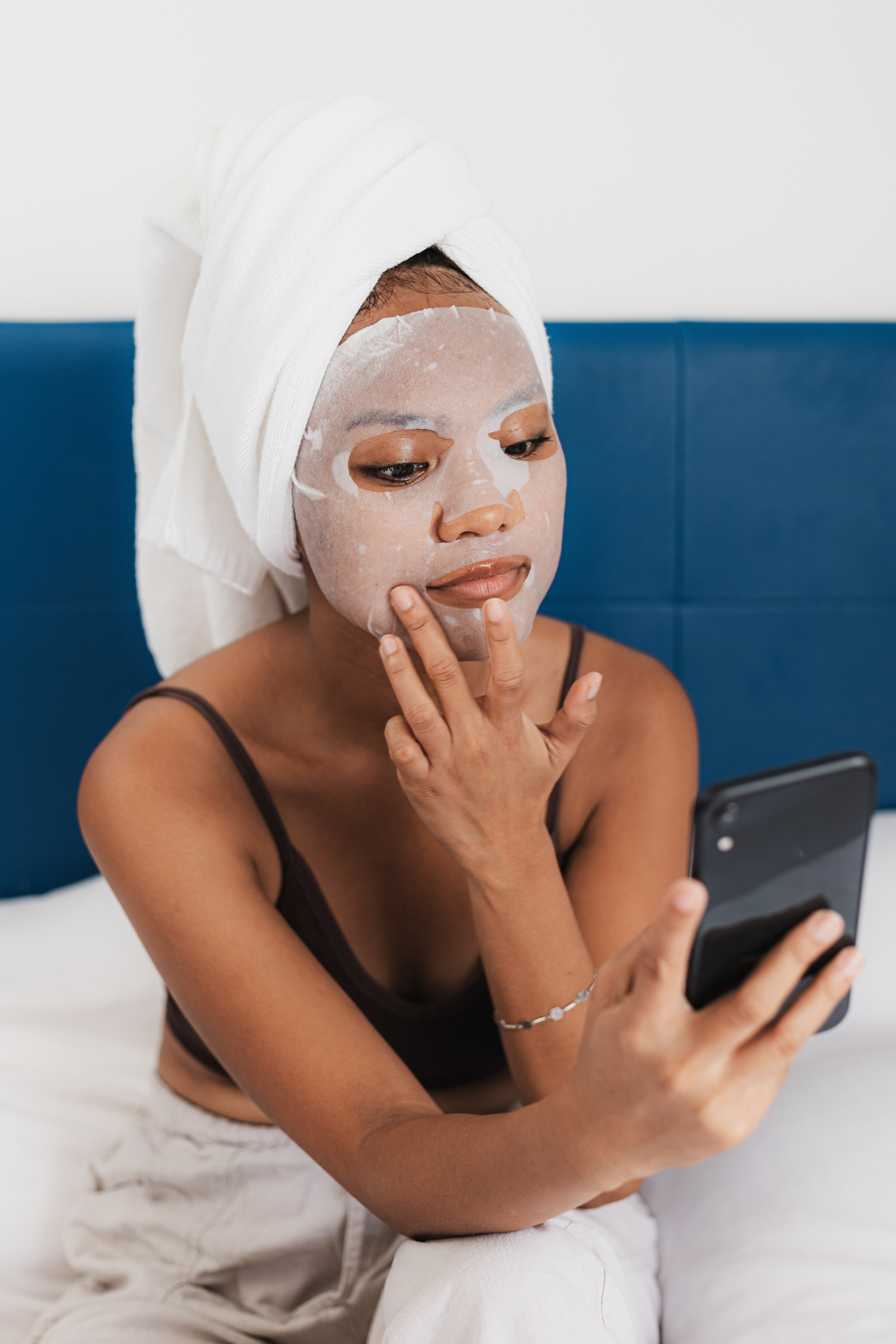 Woman Wearing a Sheet Mask After Showering 